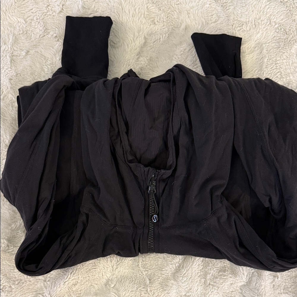 Black Lululemon reversible studio zip up with whole, thumbs hidden pockets